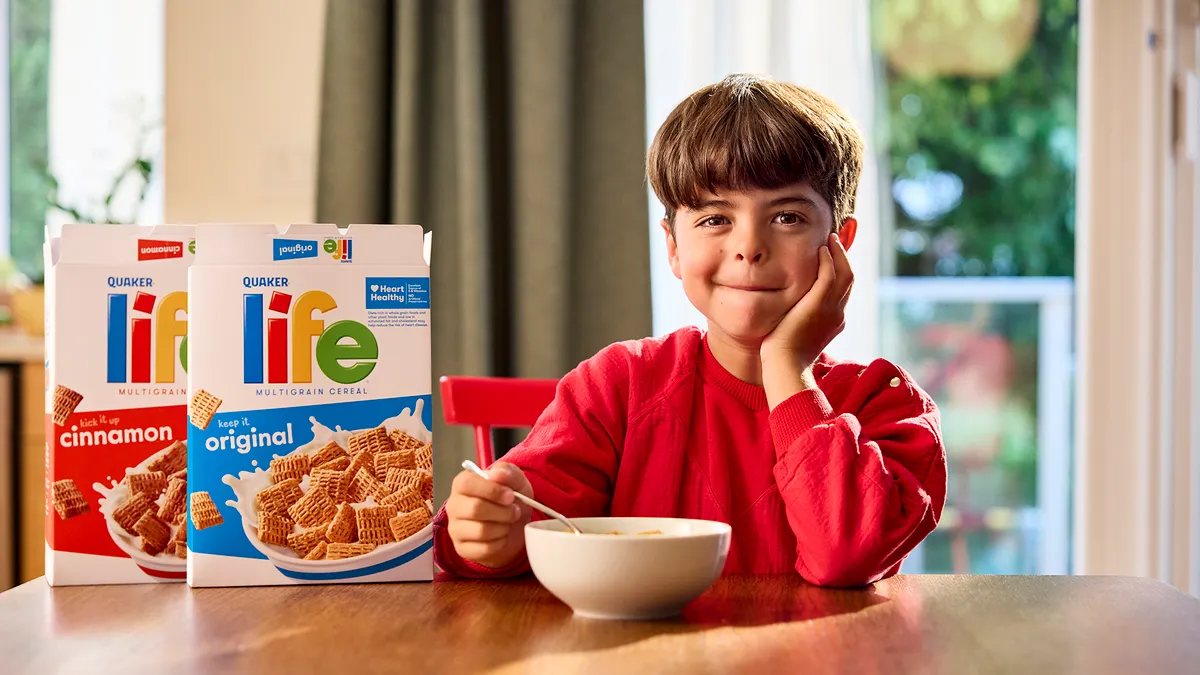 A boy playing the new Mikey for Life Cereal