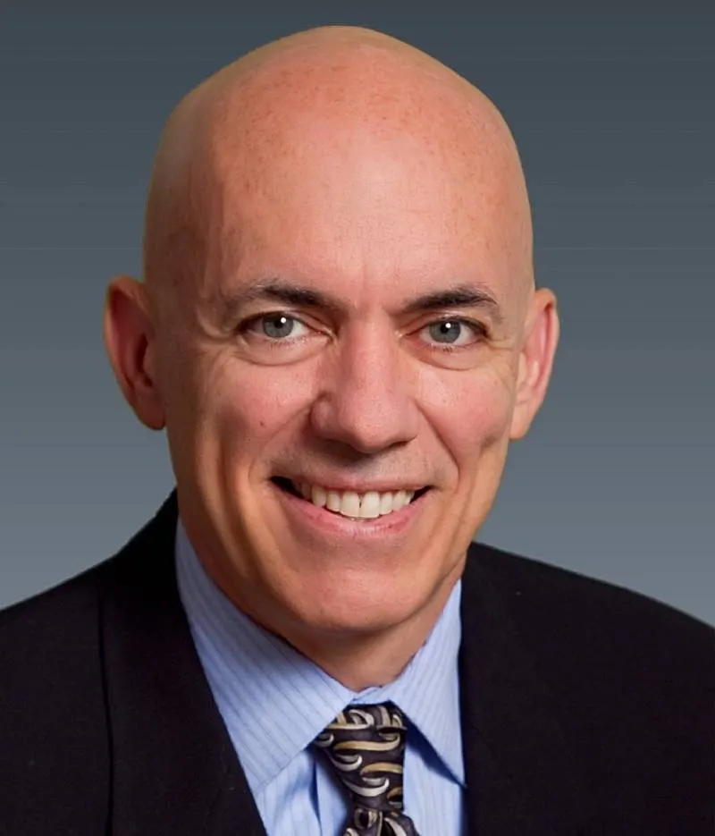 A headshot of Brett Weaver of KPMG.