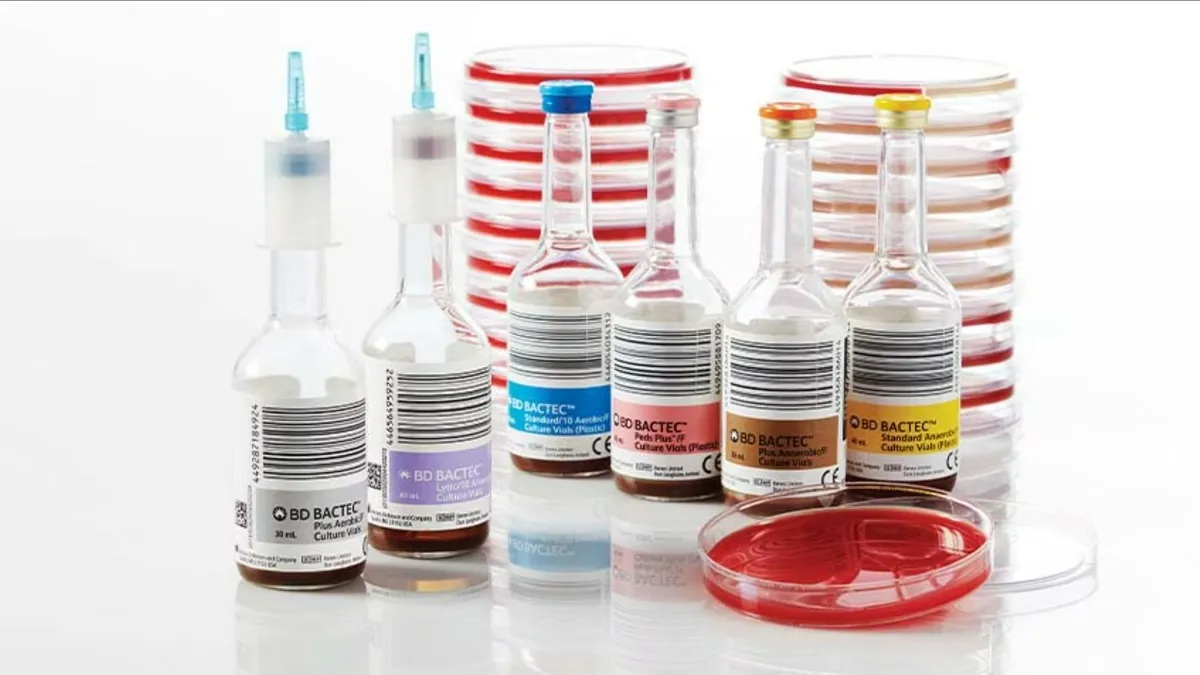 A picture of several blood culture vials against a white background.