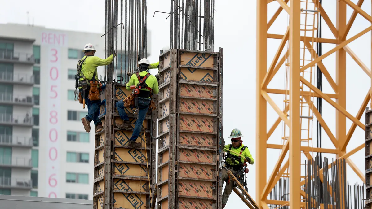 Construction workers build a residential high rise on October 02, 2023 in Miami, Florida.