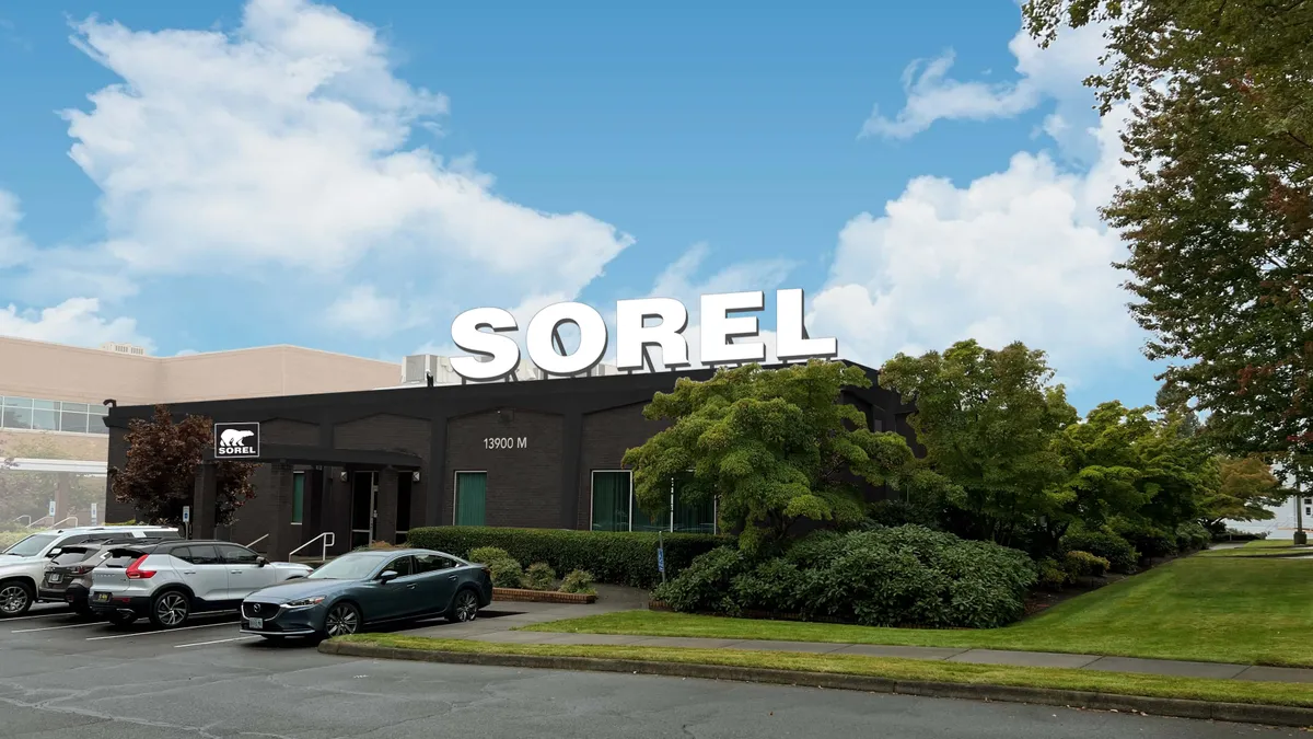 A dark brown building exterior with Sorel logo in white