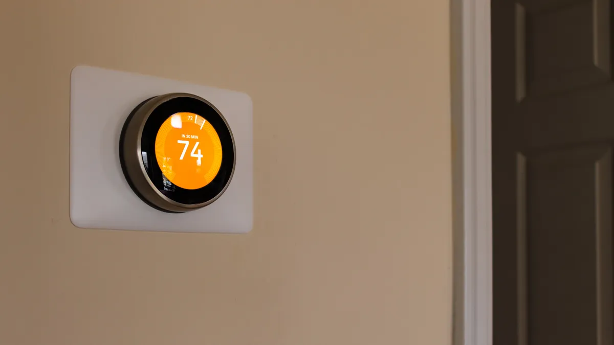 A smart thermostat in a home.