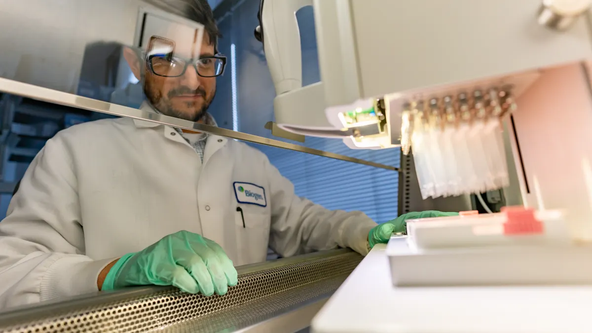 A Biogen employee at a lab bench
