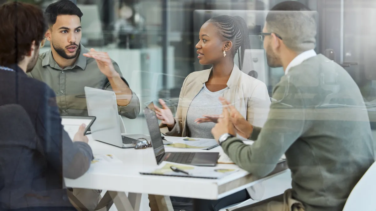 Group of businesspeople having a meeting in an office at work