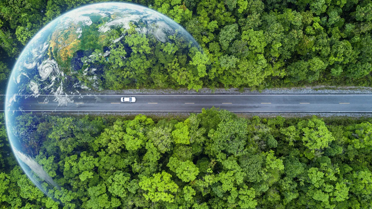 Electric car and EV electrical energy for environment, EV car on forest road with earth planet going through forest