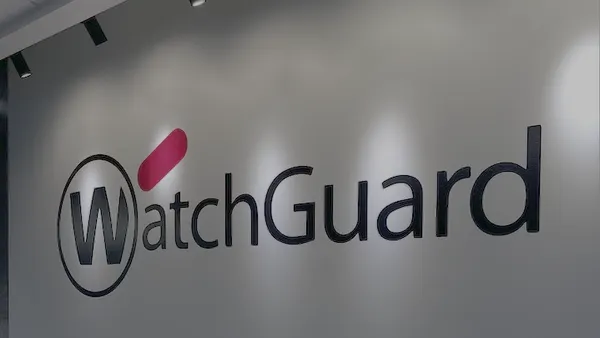 The corporate logo for cybersecurity firm WatchGuard is pictured on the wall inside an office building corridor.