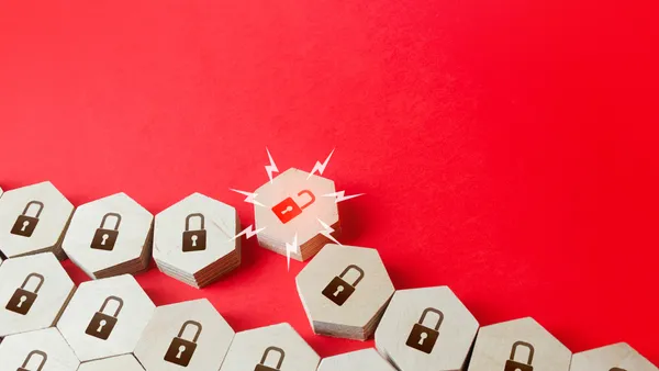 A series of hexagonal blocks with locks on them, one of which is broken, with a red background.