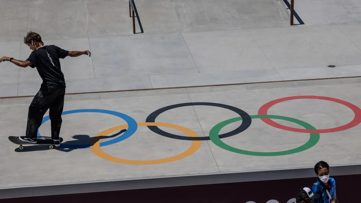 A skateboarder passes over an Olympic logo during a practice session for the Tokyo Games in 2021.