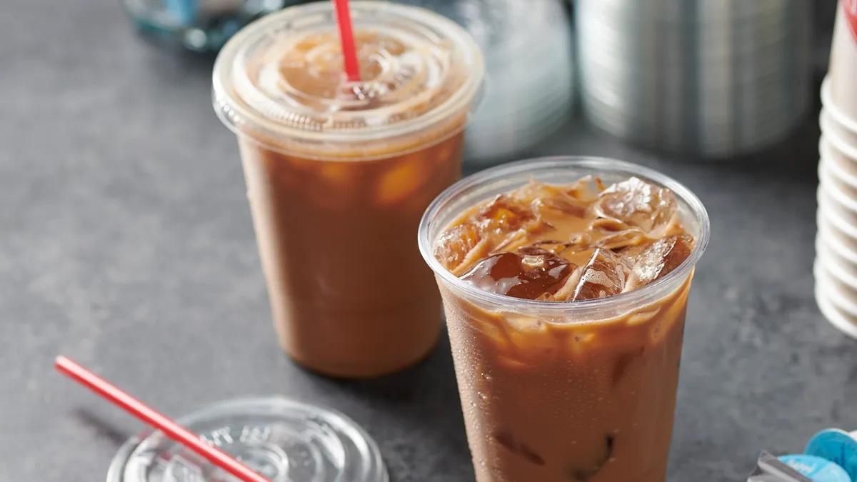 Two beverages in cups on the counter