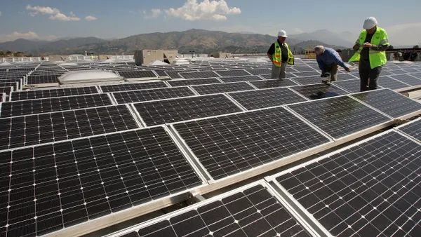 Solar panels cover the roof of a Sam's Club store.