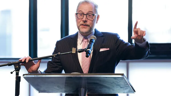 New York City Comptroller Mark Levine speaking at a lectern