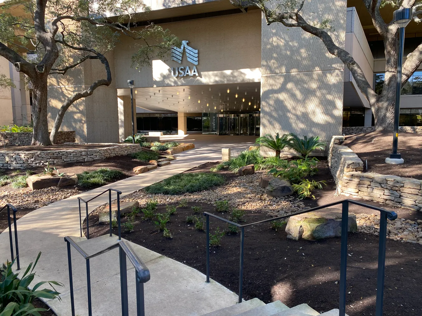 A USAA campus building is pictured with the company logo above the entrance.