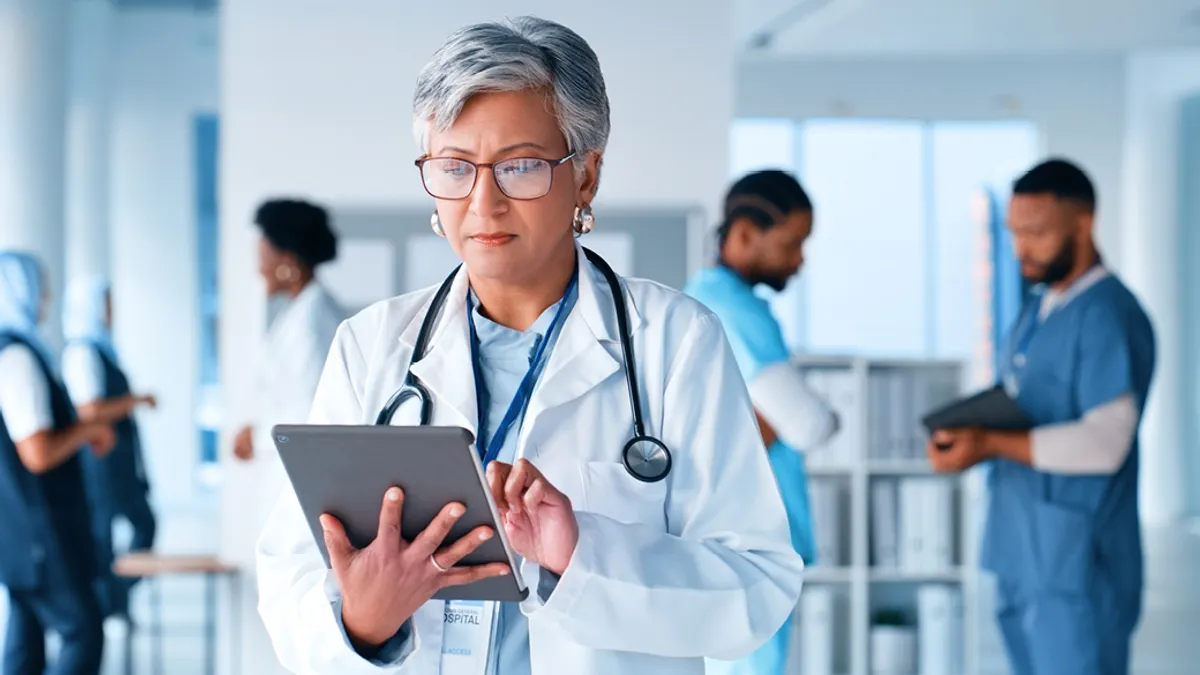Mature woman, thinking or doctor on tablet at hospital for healthcare questions, research or schedule solution.