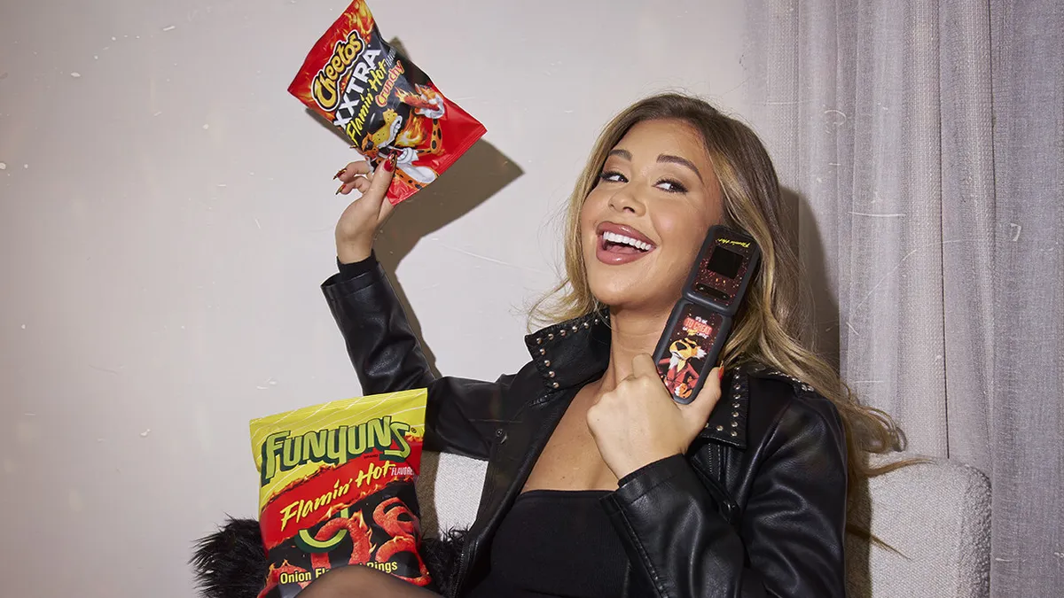 Gabby Windey appears in Flamin' Hot's “Cheat on Flamin’ Hot Cheetos" campaign