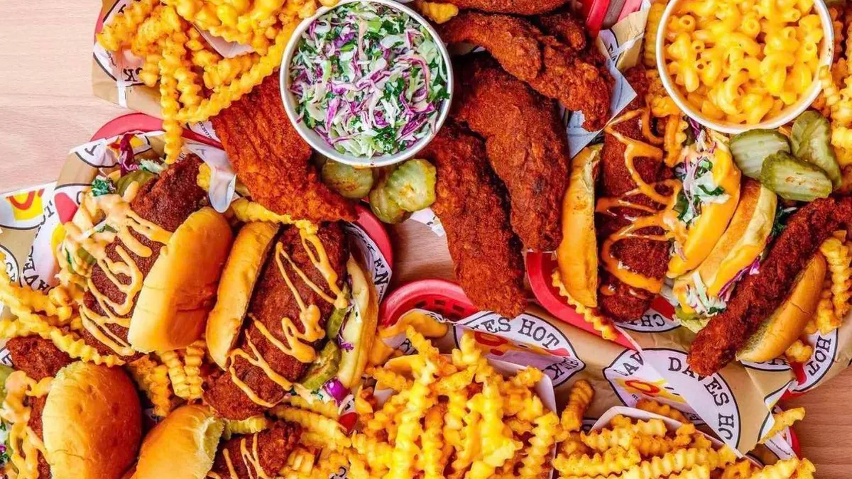 Dave's Hot Chicken food spread out on a table.