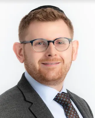 Man in jacket and tie.