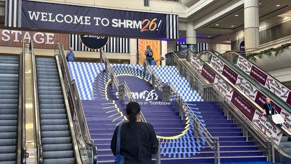 A person pauses before entering the action of SHRM 2026 in Orlando, Florida.