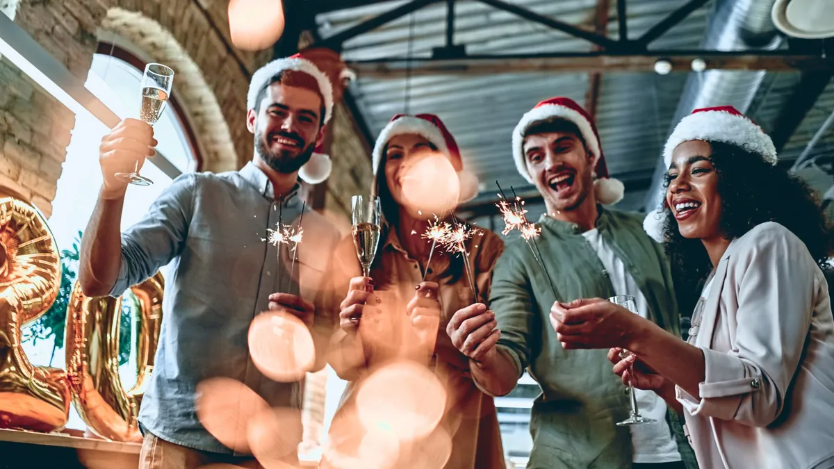 A group of young people celebrate at a Christmas party