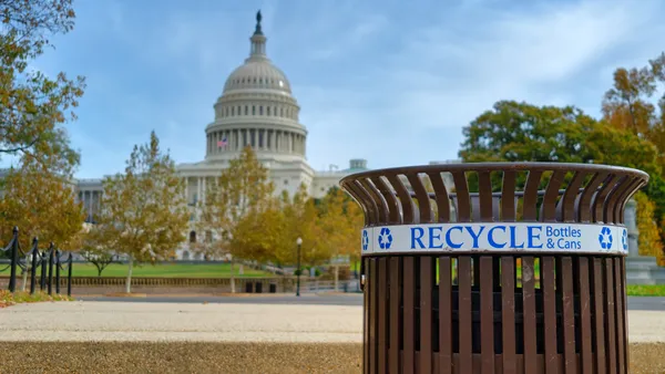 Recycle trash bin for bottles and cans in front of the United States Capitol Building