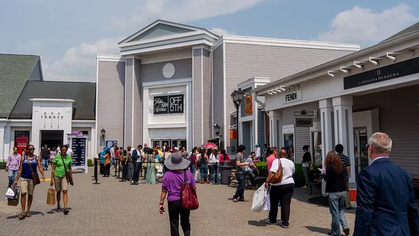People walking around an open-air mall.