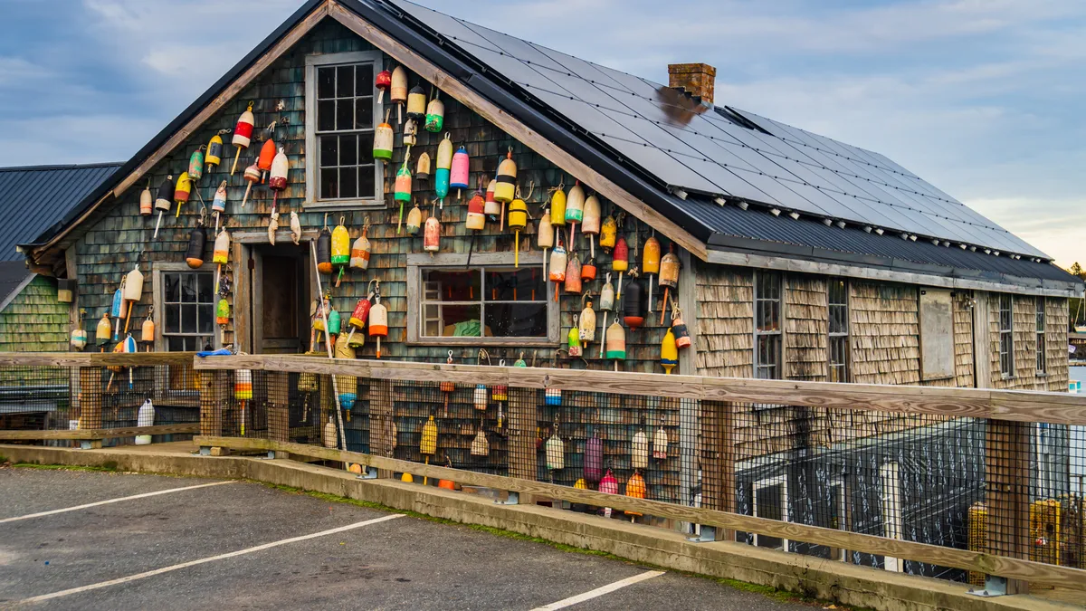 Solar panels on a lobster pound in Maine.