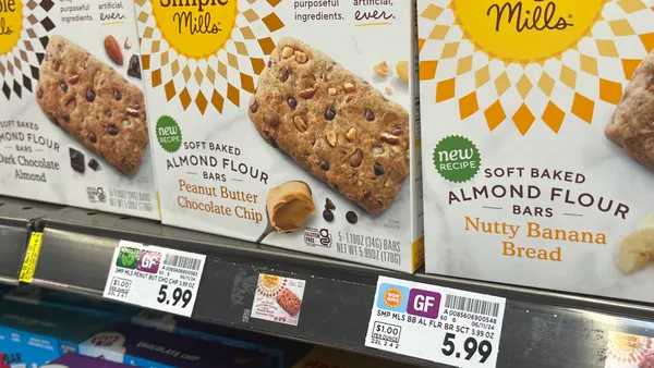 Closeup of shelf tags at a grocery store.