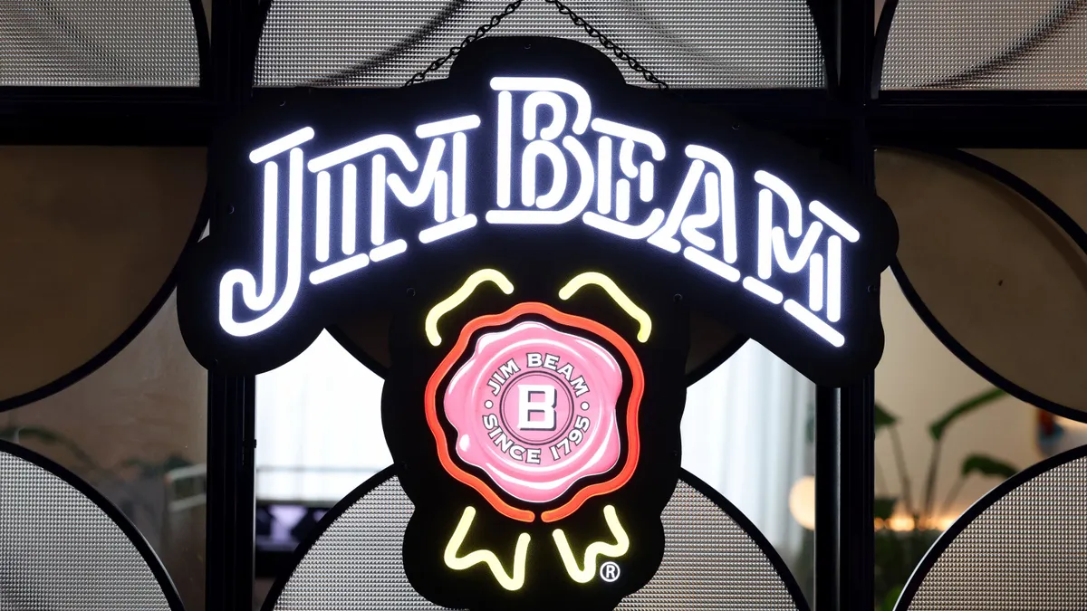 The Jim Beam logo displayed on a neon sign.