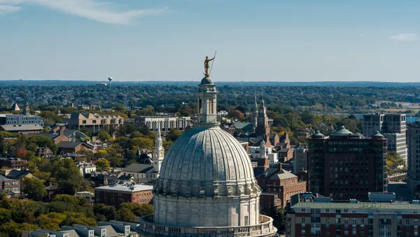 Aerial view of a government building with Providence in the background