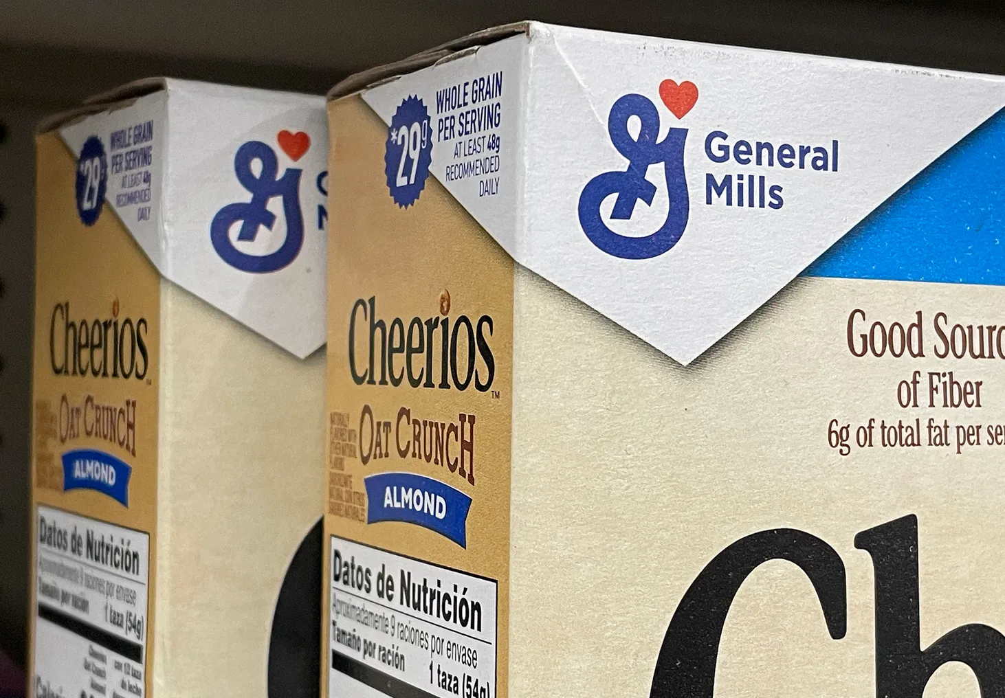 Boxes of General Mills cereal are displayed on a grocery store shelf on December 20, 2023 in San Anselmo, California