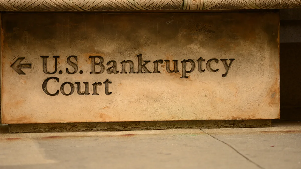 A stone sign reads "U.S. Bankruptcy Court."