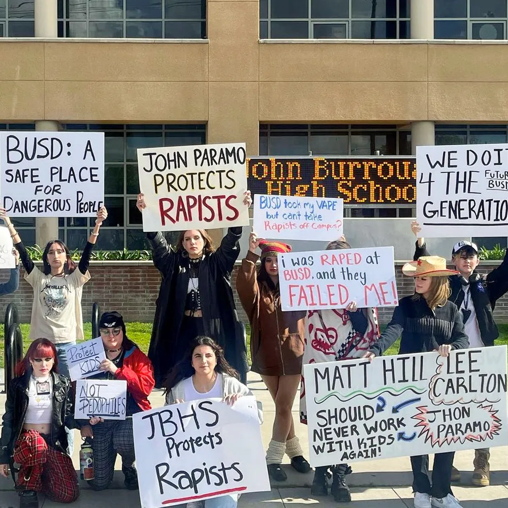 Students protest Burbank Unified School District by holding signs