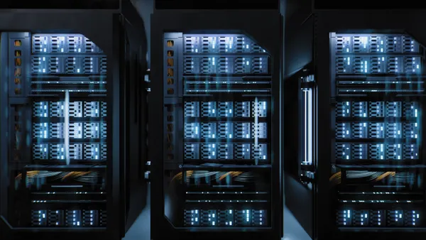 A large hallway with supercomputers inside a server room at a cloud data center