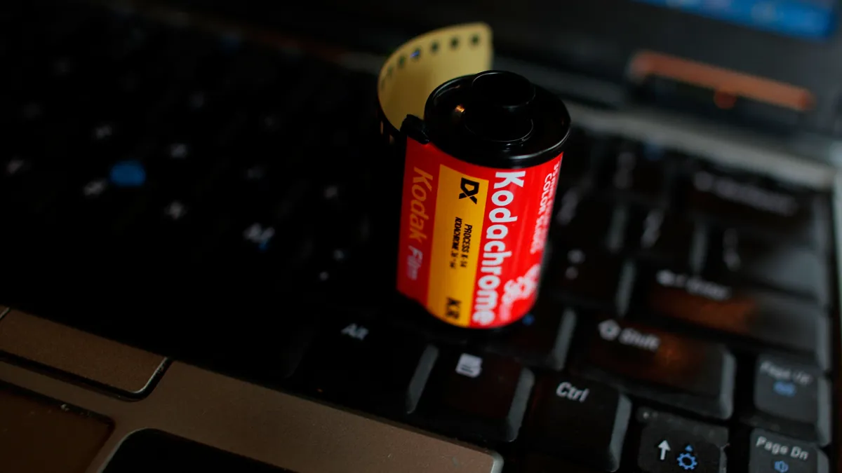 A roll of discontinued Kodachrome film on a keyboard.