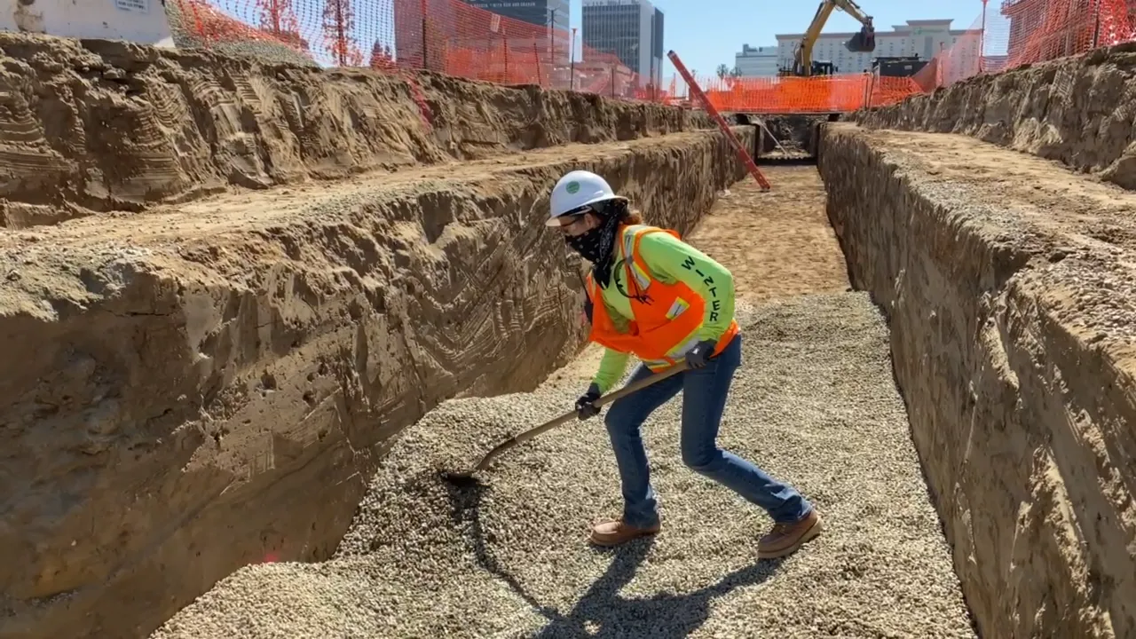 A PCL first period apprentice works at the Consolidated Rent-A-Car jobsite at LAX.