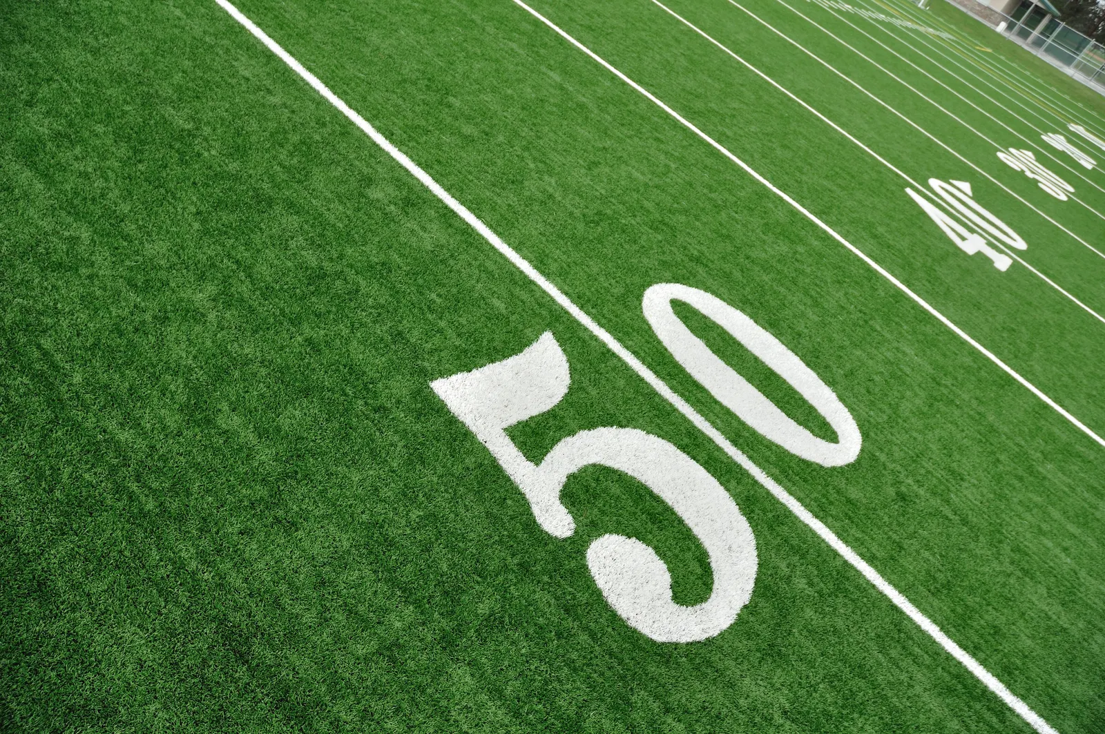 A photo of the 50-yard line on an American football field