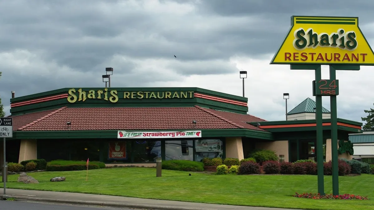 An image of a Shari's Restaurant underneath gray skies.