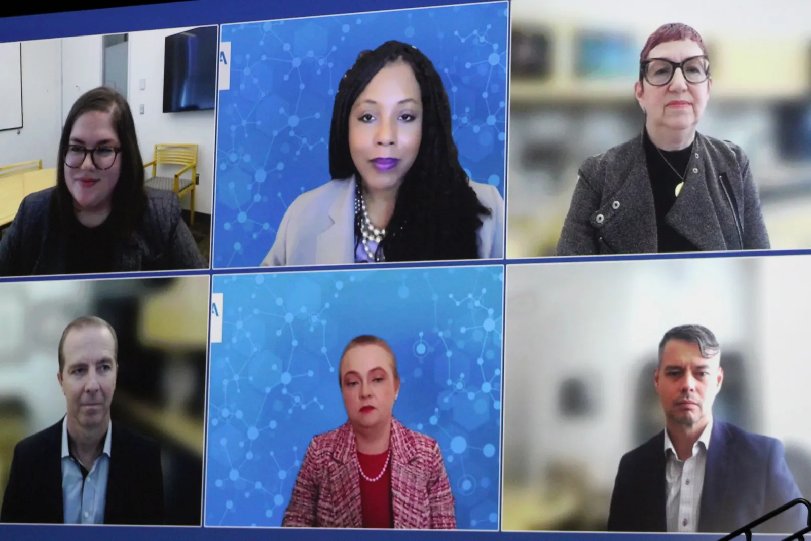 A large screen is divided between six people.