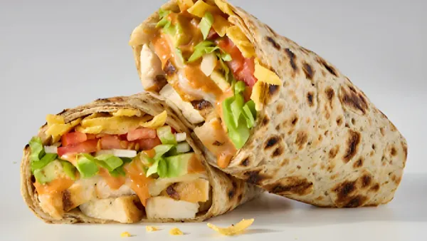 A close up image of a wrap with chicken.
