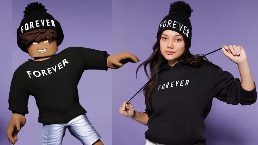 A Roblox avatar and a real life model both wear identical black beanies with the word "forever" on them.