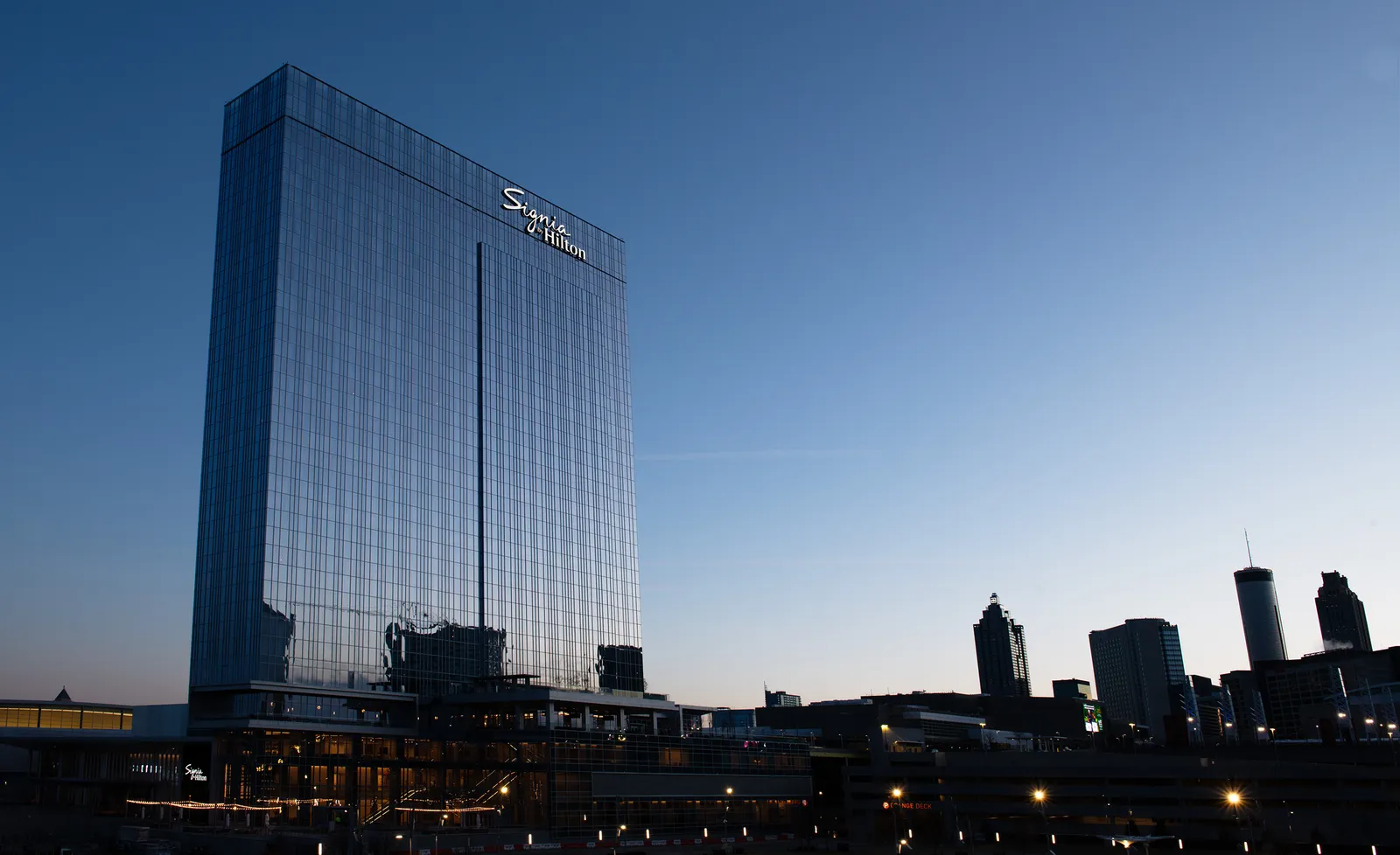 The exterior of the new hotel at sunset.