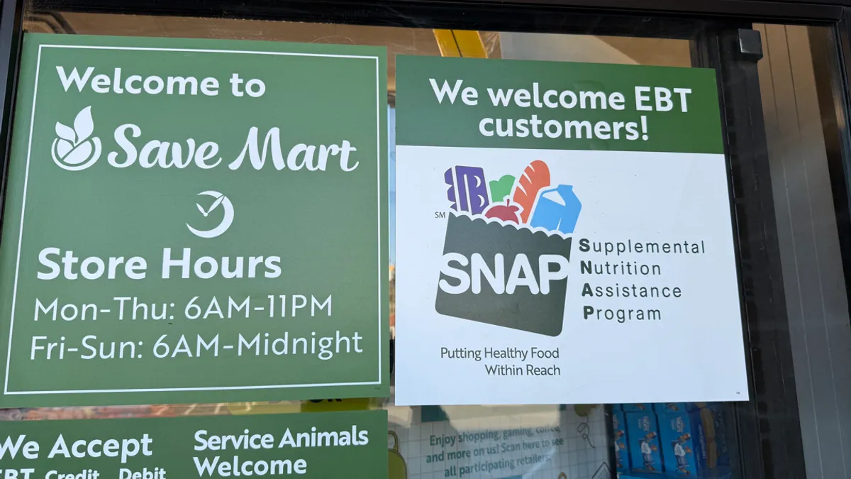 A sign about acceptance of SNAP EBT at a grocery store.