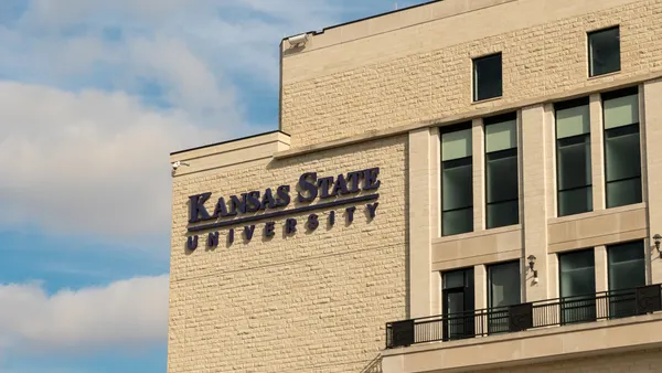 A brick building with a sign that says "Kansas State University"