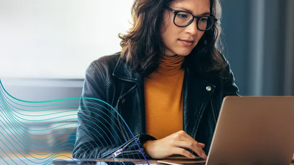person sitting at laptop
