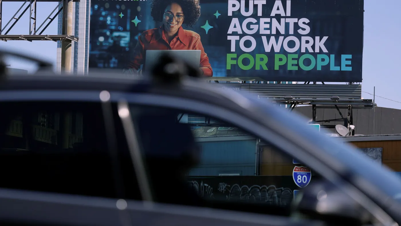 A Servicenow billboard says "Put AI agents to work for people."