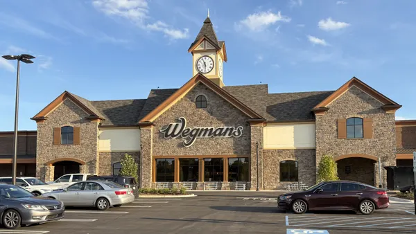 A view of a supermarket with a sign that reads “Wegmans.”