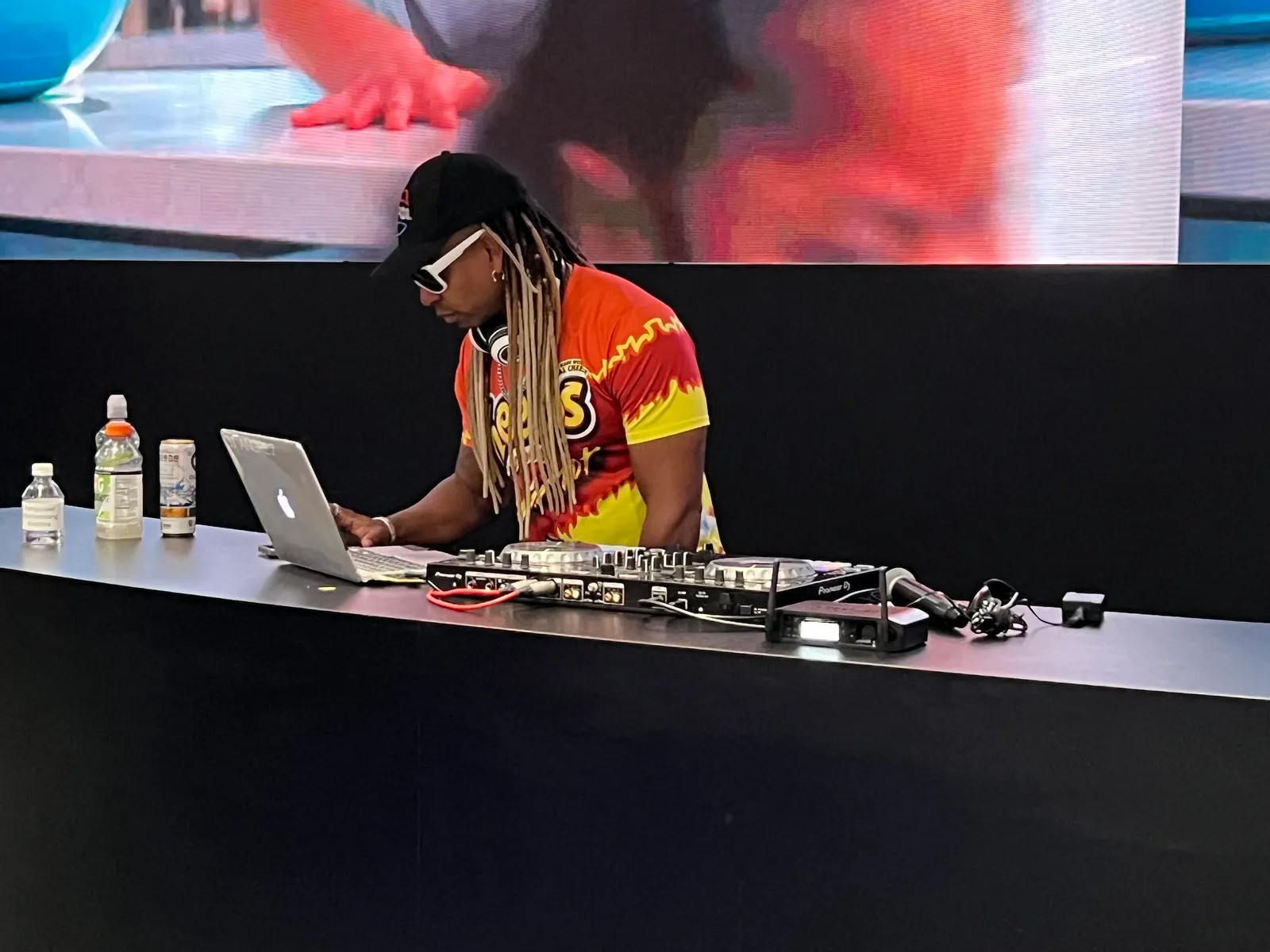 A DJ at the PepsiCo booth at the NACS Show 2025