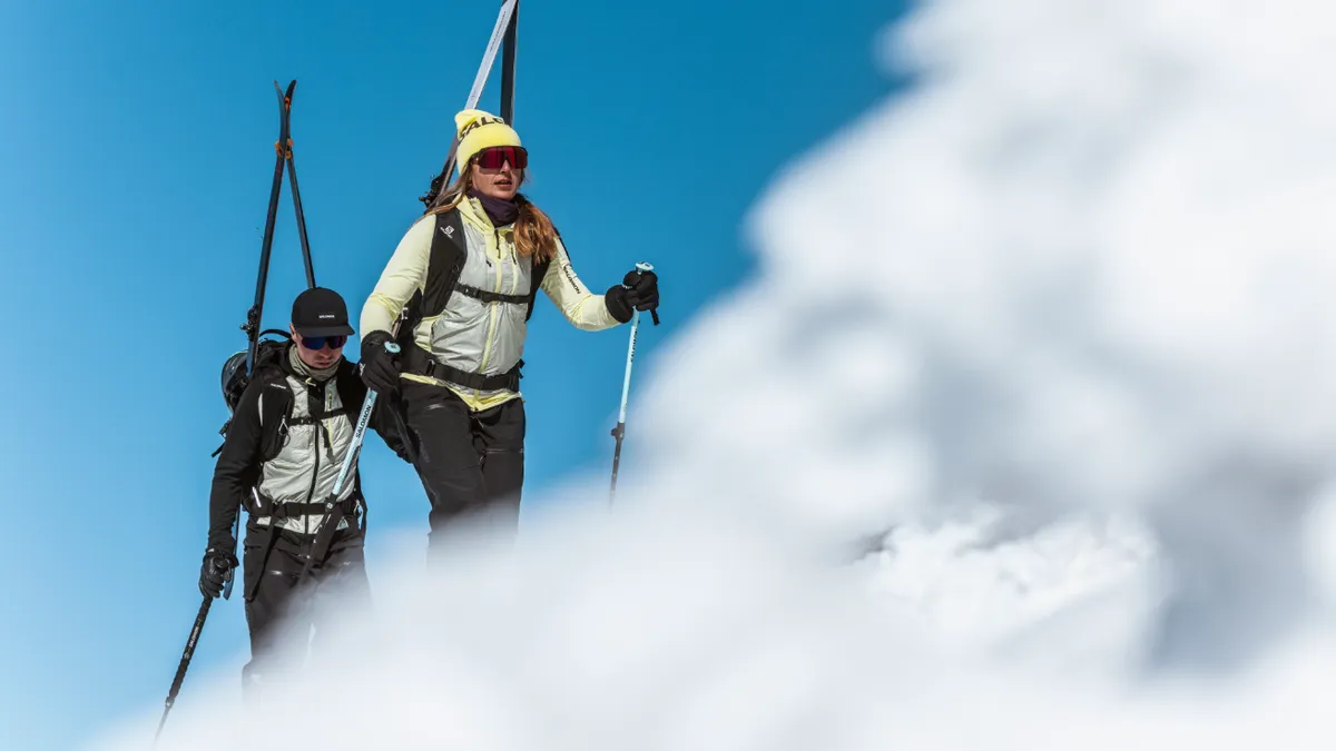 Two people hiking in the snow.