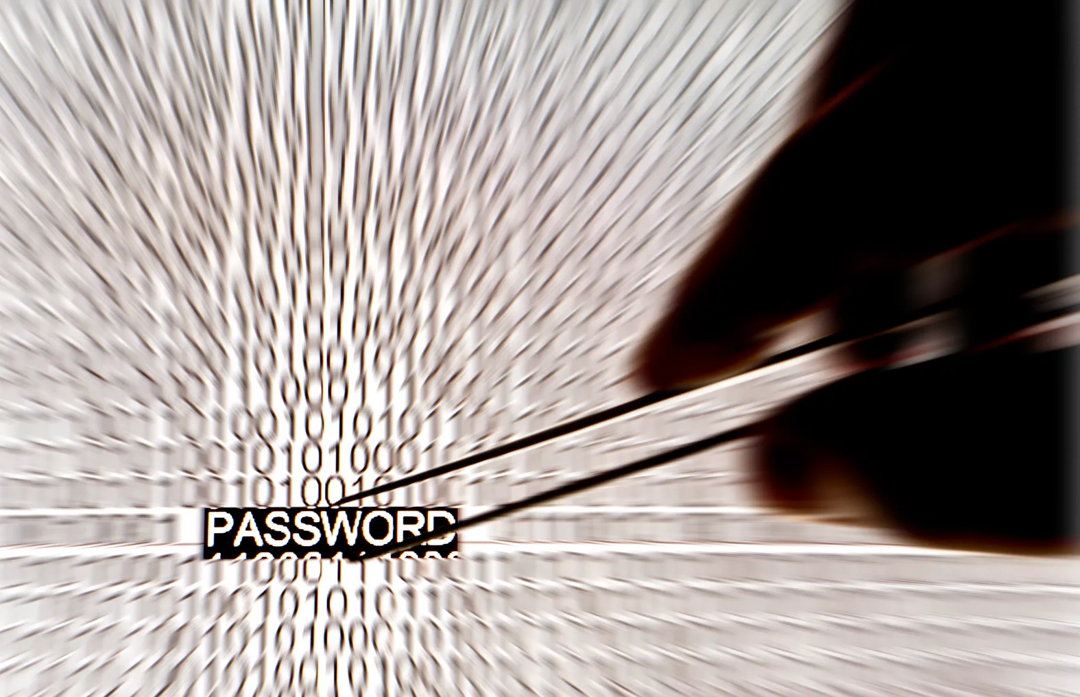 Hand grabbing password out of blurred code.