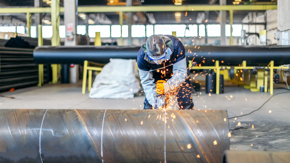 An engineer in a manufacturing warehouse working