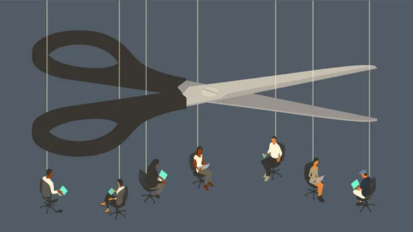 An oversized pair of scissors looms over seven workers sitting in office chairs suspended by strings.